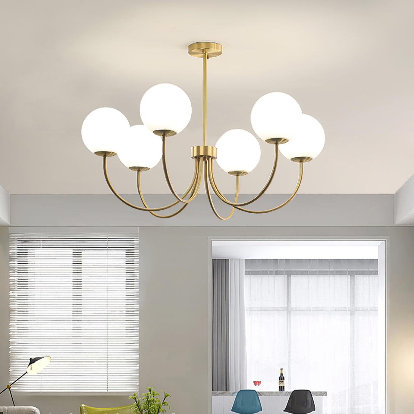 Modern Brass Globe Crown Chandelier with Elegant Curved Arms and Glass Ball Shades