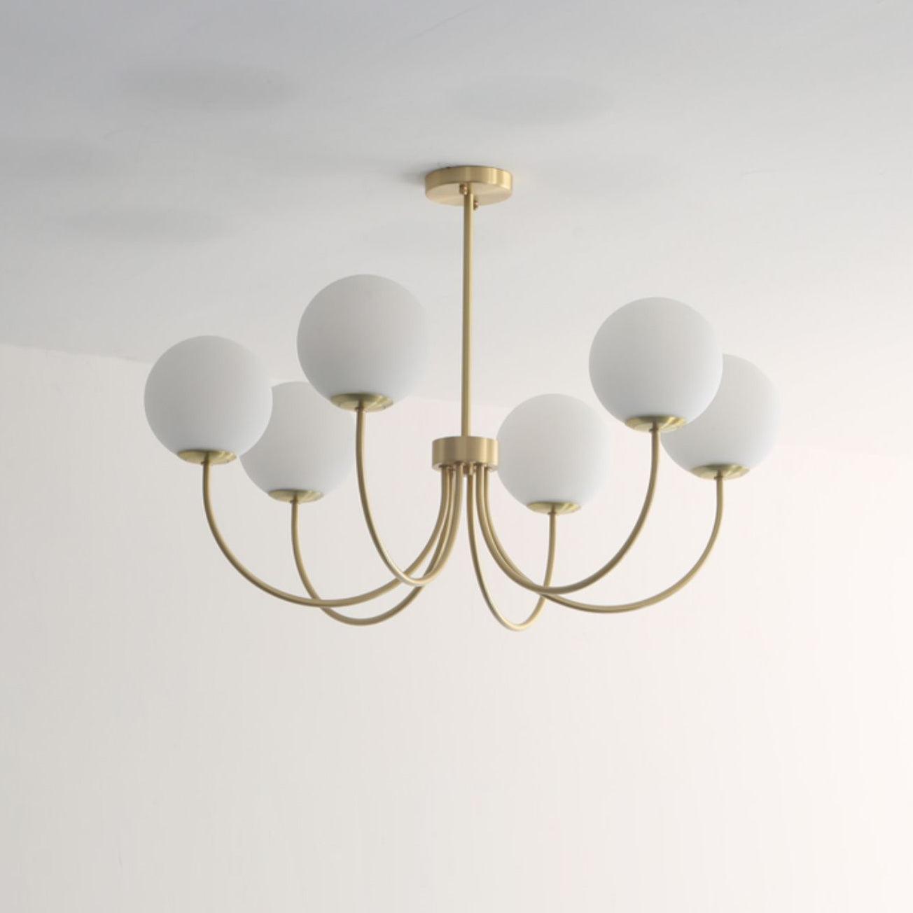 Modern Brass Globe Crown Chandelier with Elegant Curved Arms and Glass Ball Shades