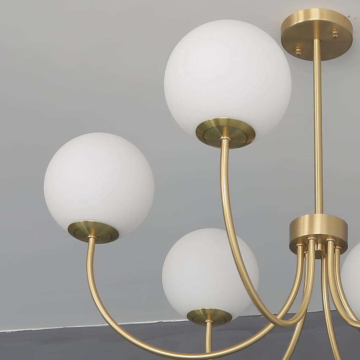 Modern Brass Globe Crown Chandelier with Elegant Curved Arms and Glass Ball Shades
