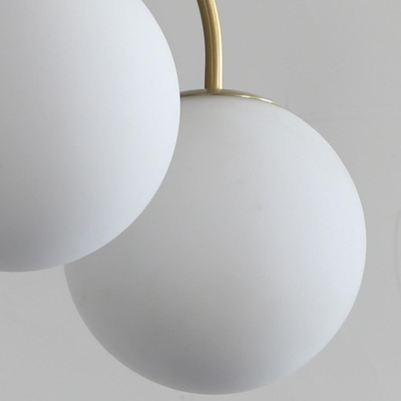 Modern Brass Globe Crown Chandelier with Elegant Curved Arms and Glass Ball Shades