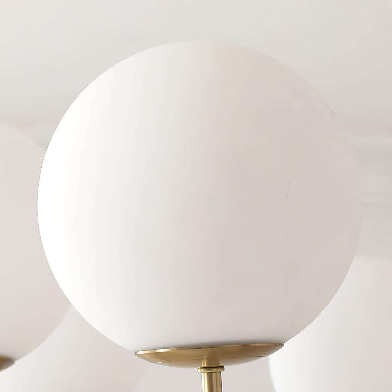 Modern Brass Globe Crown Chandelier with Elegant Curved Arms and Glass Ball Shades