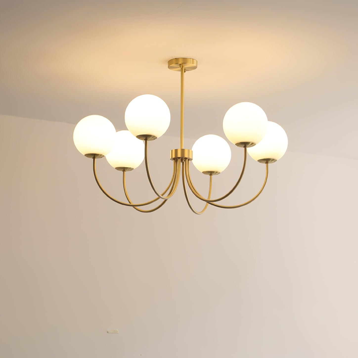 Modern Brass Globe Crown Chandelier with Elegant Curved Arms and Glass Ball Shades
