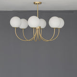 Modern Brass Globe Crown Chandelier with Elegant Curved Arms and Glass Ball Shades