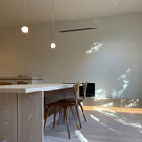 Modern Brass Rod Pendant Light with Spherical Mouth Blown Opal Glass Globe