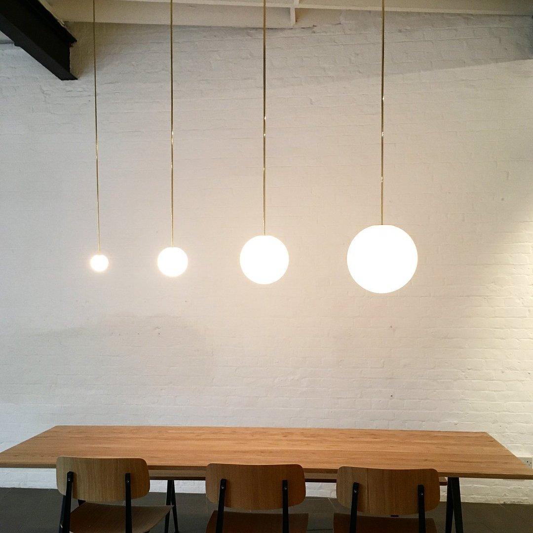 Modern Brass Rod Pendant Light with Spherical Mouth Blown Opal Glass Globe