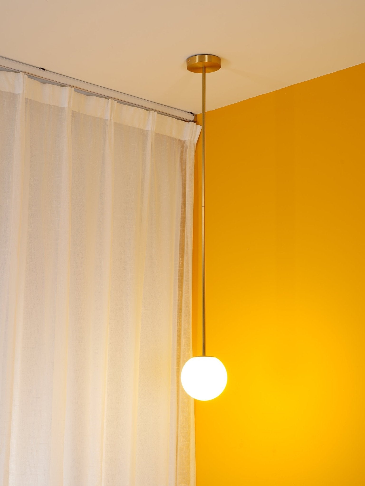 Modern Brass Rod Pendant Light with Spherical Mouth Blown Opal Glass Globe