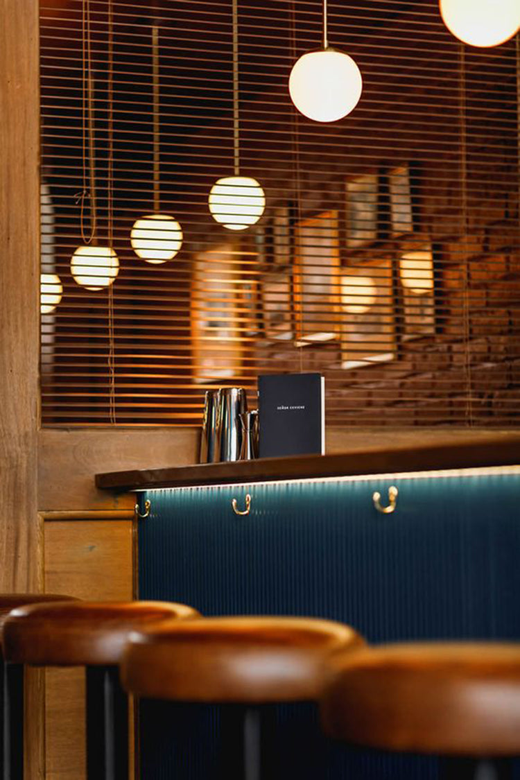 Modern Brass Rod Pendant Light with Spherical Mouth Blown Opal Glass Globe
