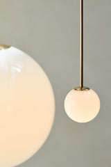 Modern Brass Rod Pendant Light with Spherical Mouth Blown Opal Glass Globe