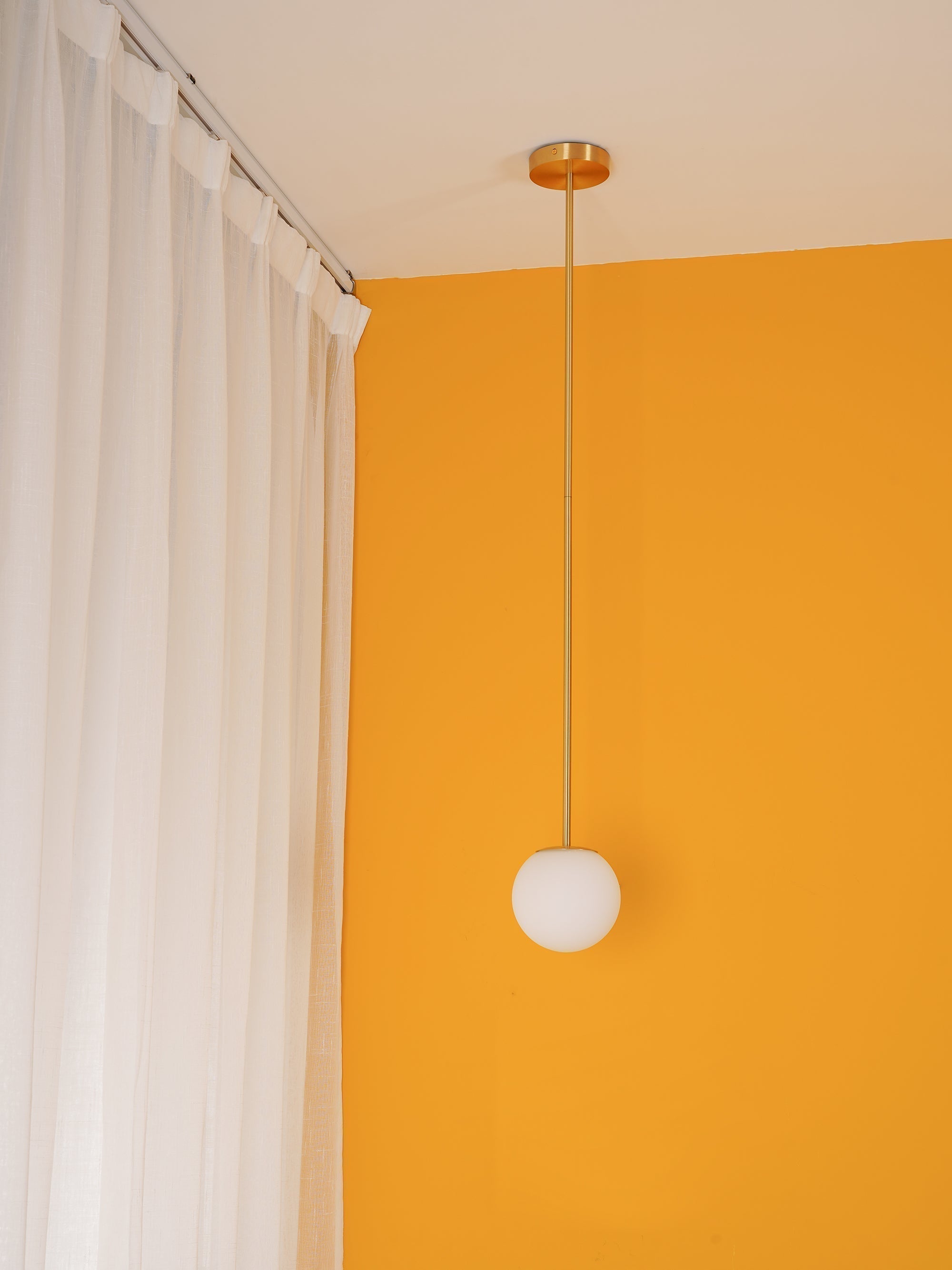 Modern Brass Rod Pendant Light with Spherical Mouth Blown Opal Glass Globe