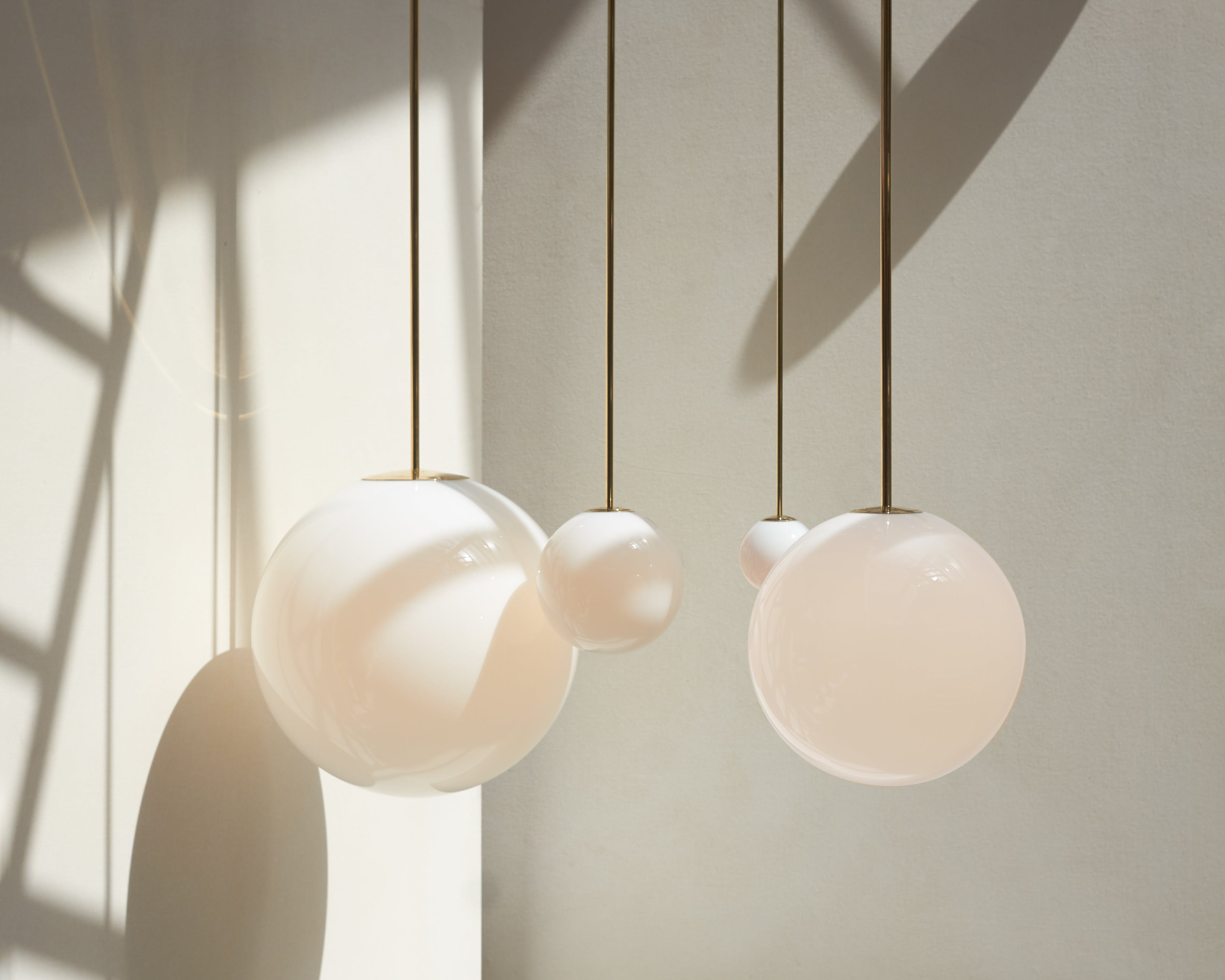 Modern Brass Rod Pendant Light with Spherical Mouth Blown Opal Glass Globe