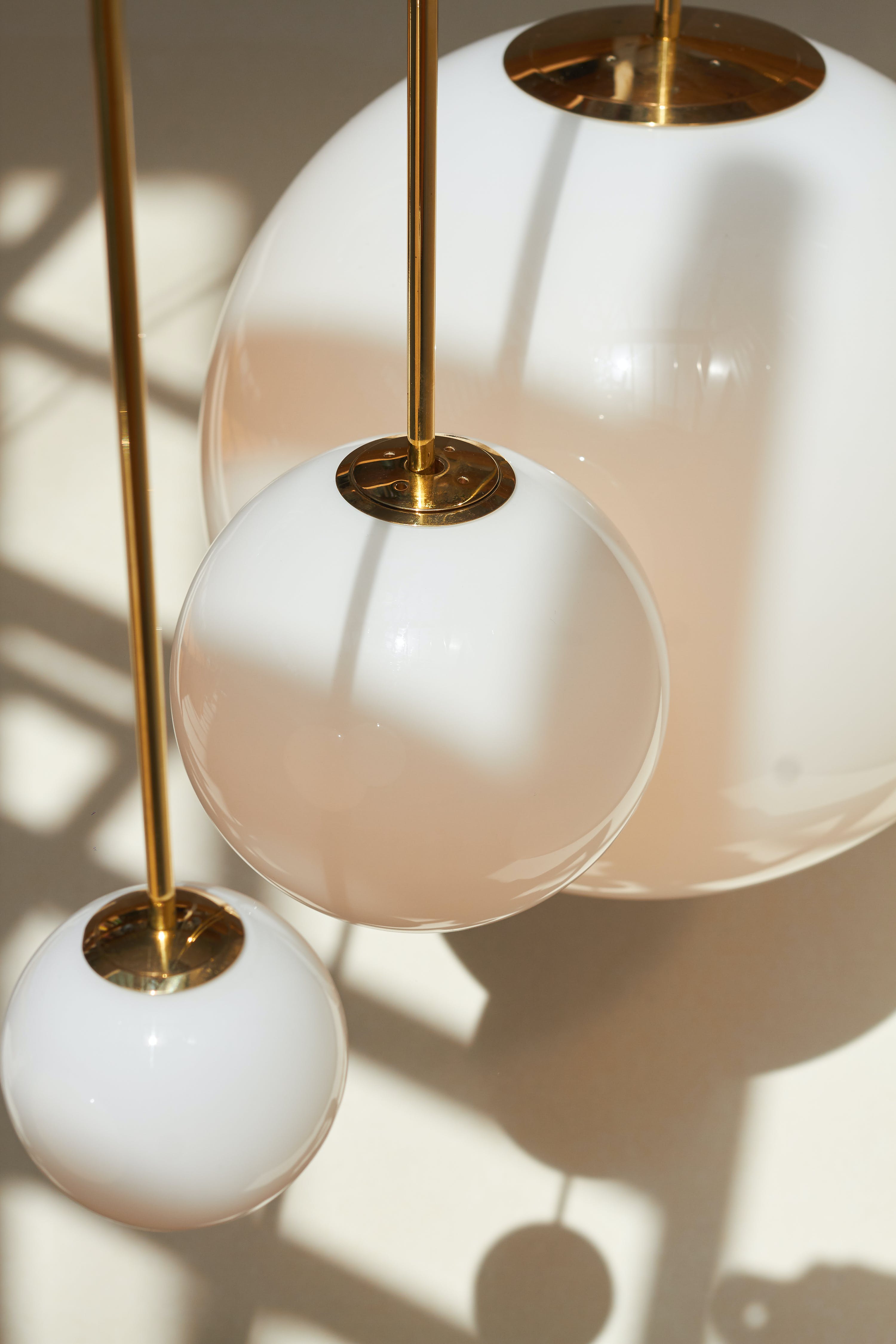 Modern Brass Rod Pendant Light with Spherical Mouth Blown Opal Glass Globe
