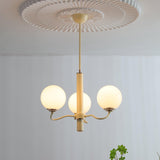Modern Creamy Yellow Globe Glass Chandelier with White Spherical Shades