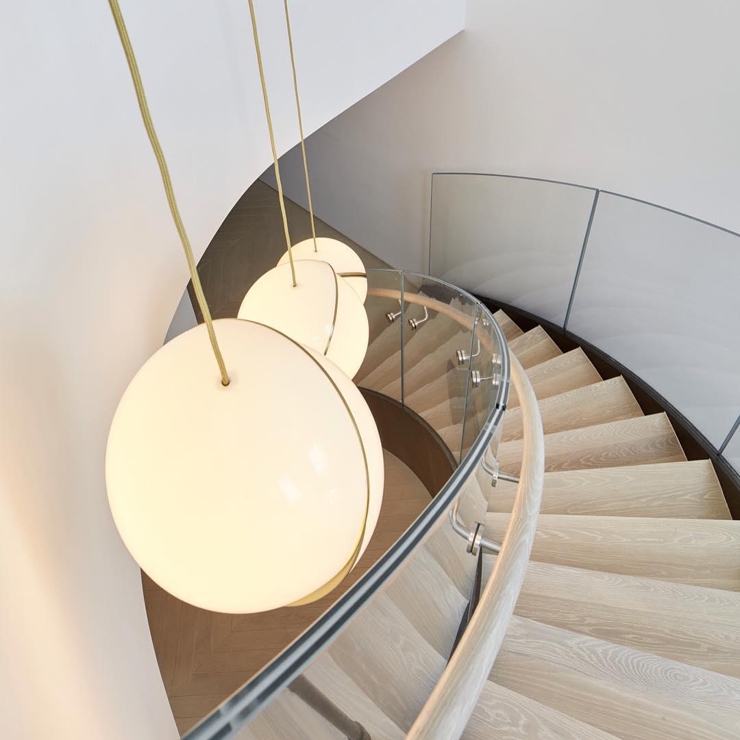 Modern Crescent Brass Pendant Light with Opal Globe Shade and Brushed Fascia