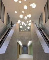 Modern Crescent Brass Pendant Light with Opal Globe Shade and Brushed Fascia