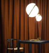 Modern Crescent Brass Pendant Light with Opal Globe Shade and Brushed Fascia