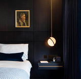 Modern Crescent Brass Pendant Light with Opal Globe Shade and Brushed Fascia