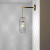 modern-cylinder-glass-wall-sconce-with-perforated-metal-cage-and-steel-accents-for-home-decor