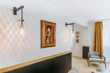 modern-cylinder-glass-wall-sconce-with-perforated-metal-cage-and-steel-accents-for-home-decor