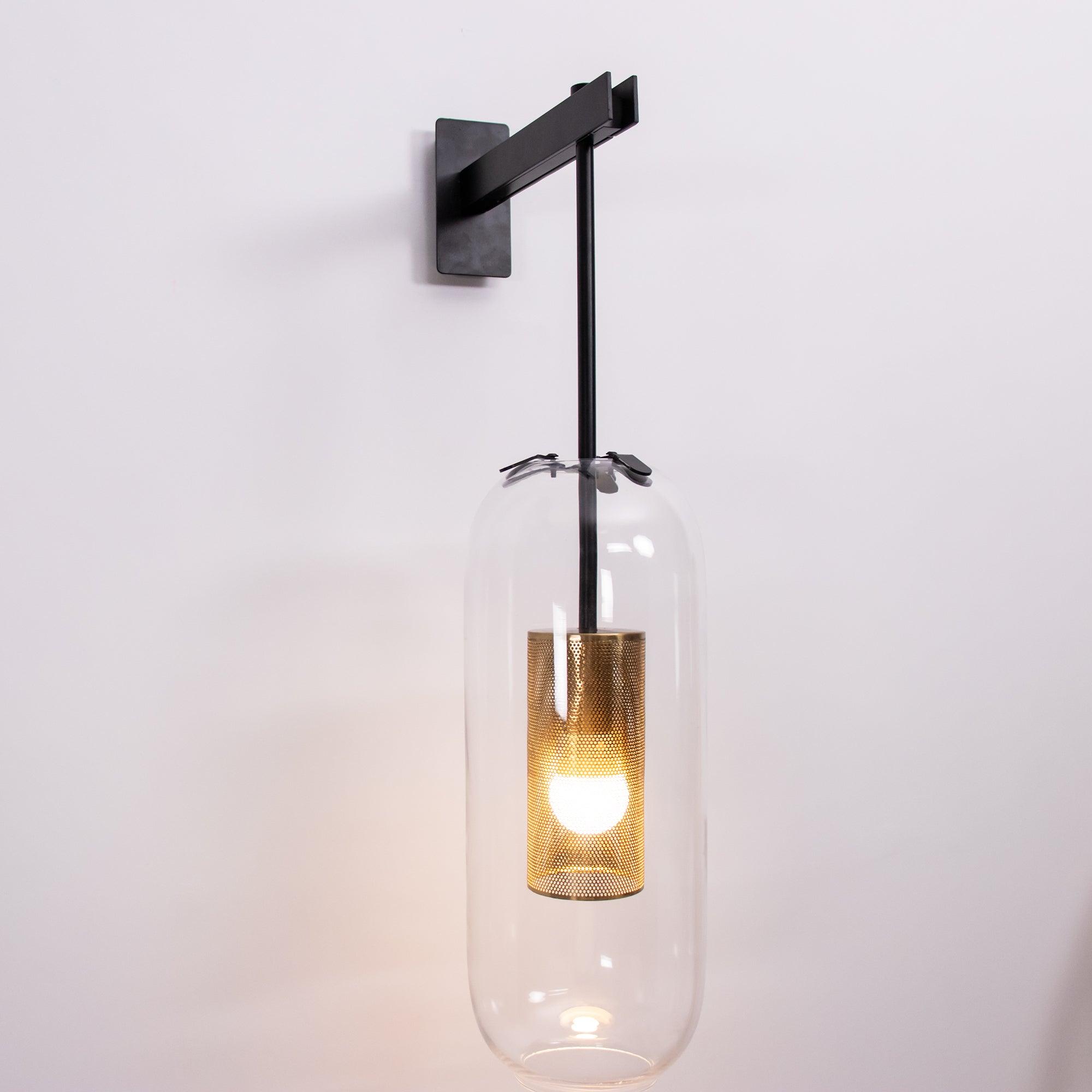 modern-cylinder-glass-wall-sconce-with-perforated-metal-cage-and-steel-accents-for-home-decor