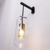 modern-cylinder-glass-wall-sconce-with-perforated-metal-cage-and-steel-accents-for-home-decor