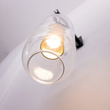 modern-cylinder-glass-wall-sconce-with-perforated-metal-cage-and-steel-accents-for-home-decor