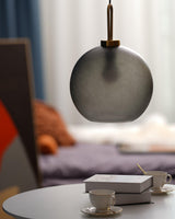 Modern Glass Capsule and Sphere Pendant Light with Copper Finish for Interior Decor