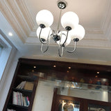 Modern Glass Globe Crown Chandelier with Elegant Chrome Curved Arms