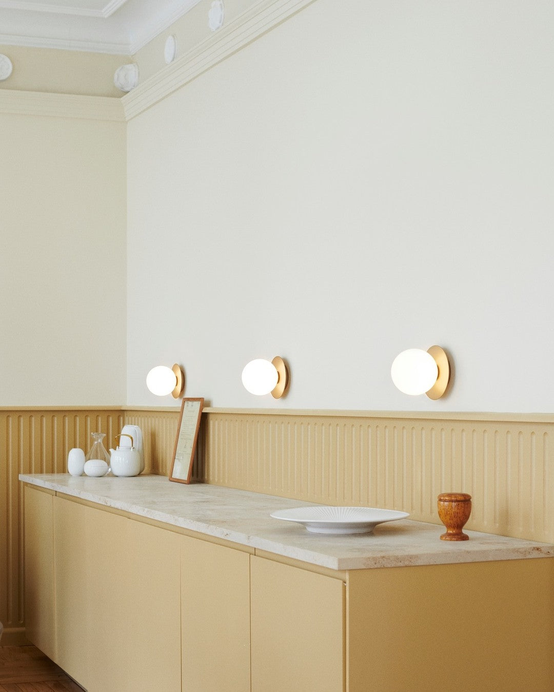 Modern Glass Globe Wall Sconce and Ceiling Lamp with Brass Metal Disc for Elegant Interior Decor