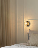 Modern Glass Globe Wall Sconce and Ceiling Lamp with Brass Metal Disc for Elegant Interior Decor