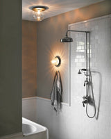 Modern Glass Globe Wall Sconce and Ceiling Lamp with Brass Metal Disc for Elegant Interior Decor
