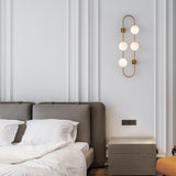 Modern Glass Globe Wall Sconce with Gold Metal Branch and Vertical Hanging Rod