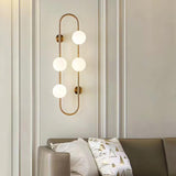 Modern Glass Globe Wall Sconce with Gold Metal Branch and Vertical Hanging Rod