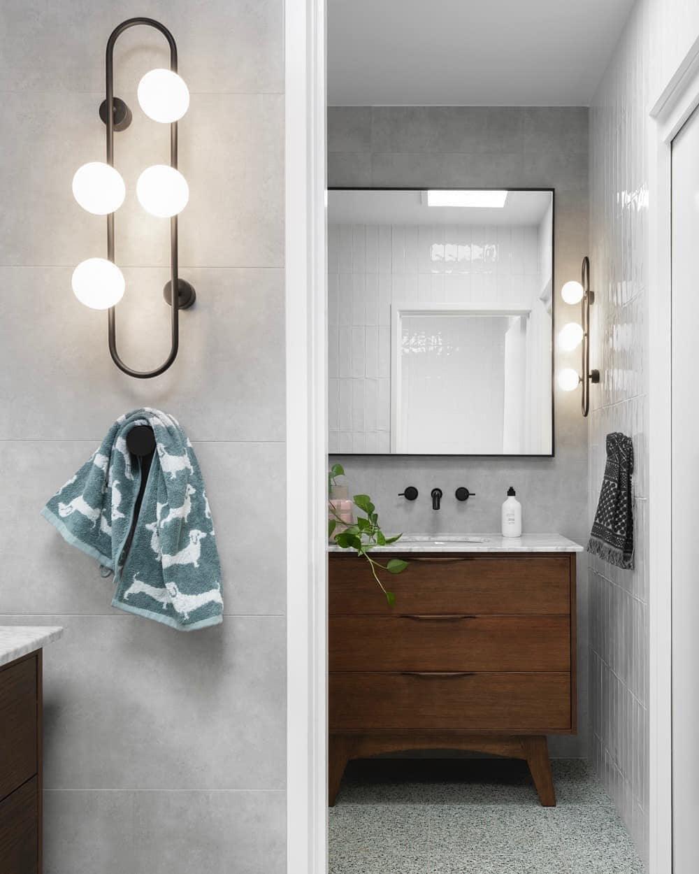 Modern Glass Globe Wall Sconce with Gold Metal Branch and Vertical Hanging Rod