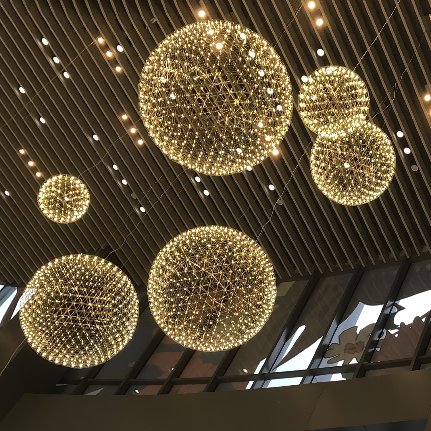 Modern Gold LED Spark Ball Pendant Light Spherical Fireworks Chandelier for Modern Interiors