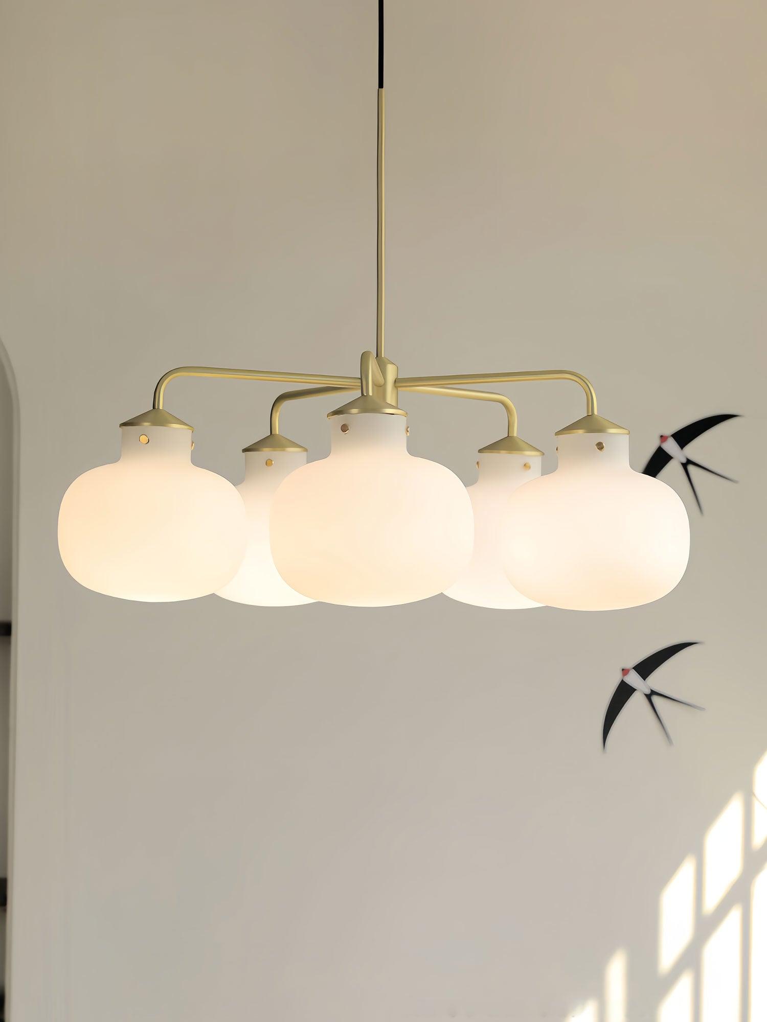 Modern Gold Metal and Opal Glass Globe Pendant Light for Contemporary Interiors