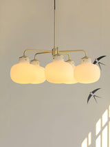 Modern Gold Metal and Opal Glass Globe Pendant Light for Contemporary Interiors