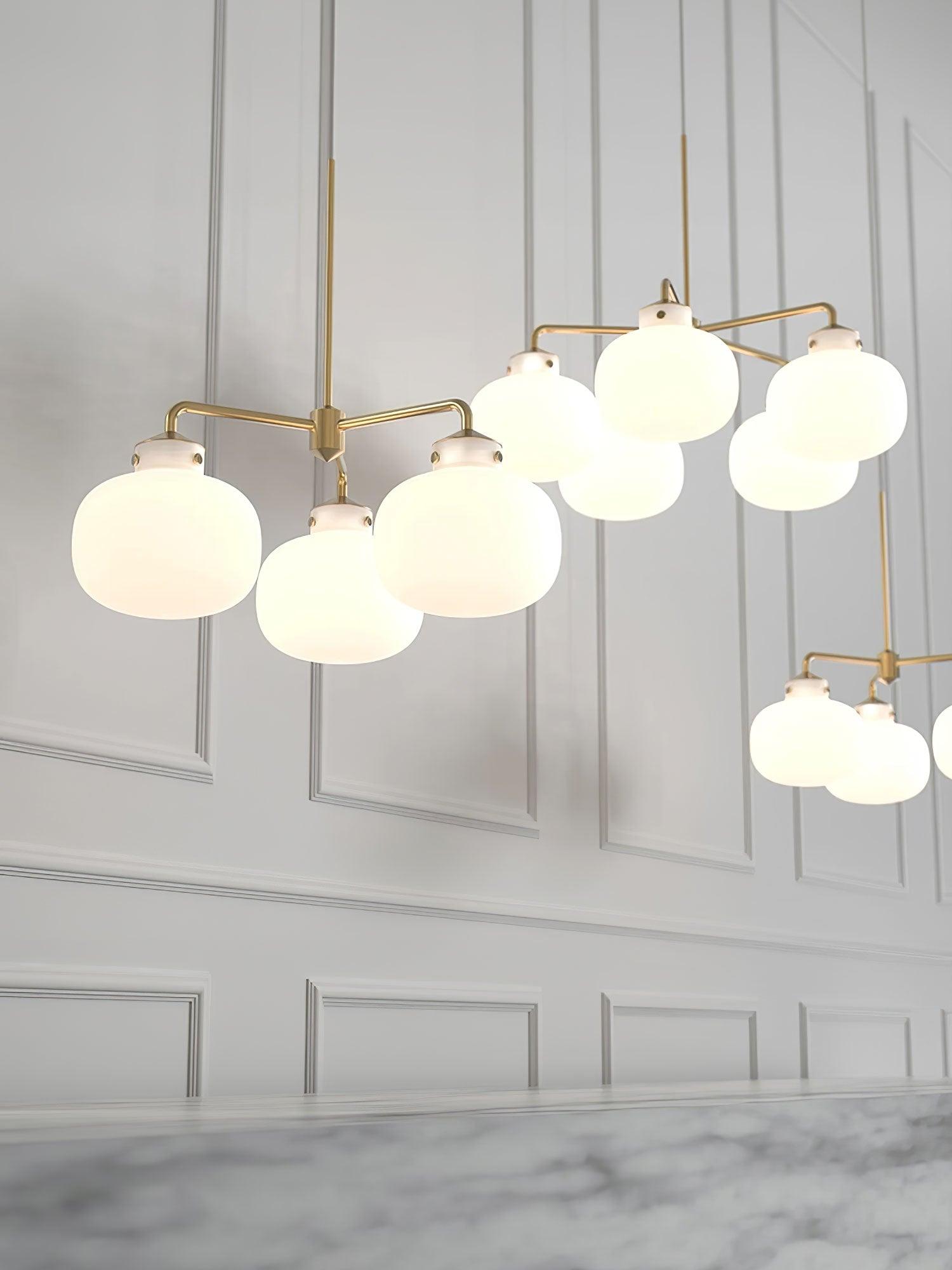 Modern Gold Metal and Opal Glass Globe Pendant Light for Contemporary Interiors