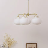 Modern Gold Metal and Opal Glass Globe Pendant Light for Contemporary Interiors