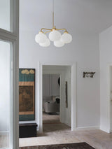 Modern Gold Metal and Opal Glass Globe Pendant Light for Contemporary Interiors
