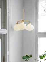 Modern Gold Metal and Opal Glass Globe Pendant Light for Contemporary Interiors