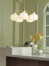 Modern Gold Metal and Opal Glass Globe Pendant Light for Contemporary Interiors