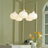 Modern Gold Metal and Opal Glass Globe Pendant Light for Contemporary Interiors