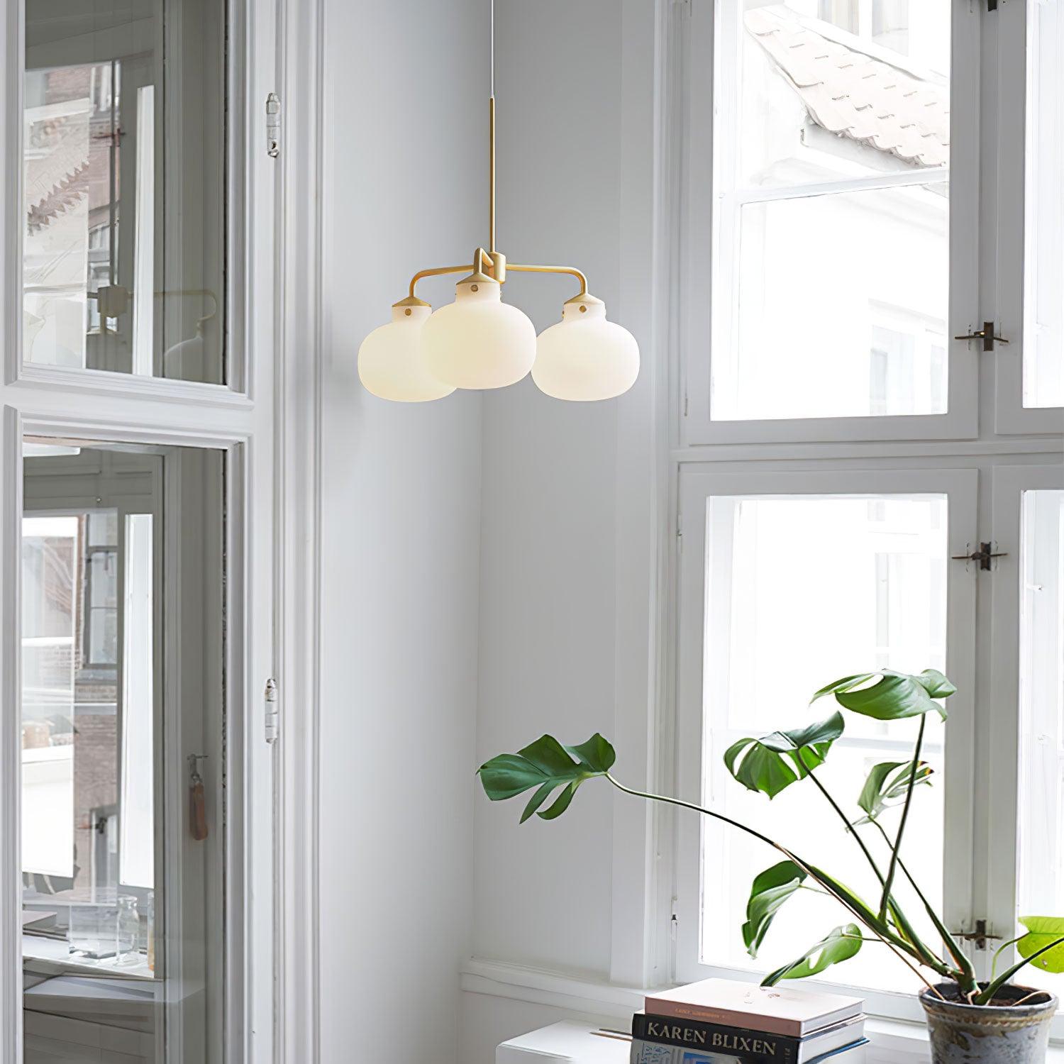 Modern Gold Metal and Opal Glass Globe Pendant Light for Contemporary Interiors