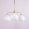 Modern Gold Metal and Opal Glass Globe Pendant Light for Contemporary Interiors