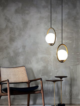 modern-hand-blown-glass-sphere-pendant-light-with-brushed-brass-metal-frame-for-elegant-interior-lighting