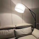 modern-marble-base-floor-lamp-with-oversized-white-linen-shade-and-iron-stand
