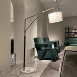 modern-marble-base-floor-lamp-with-oversized-white-linen-shade-and-iron-stand