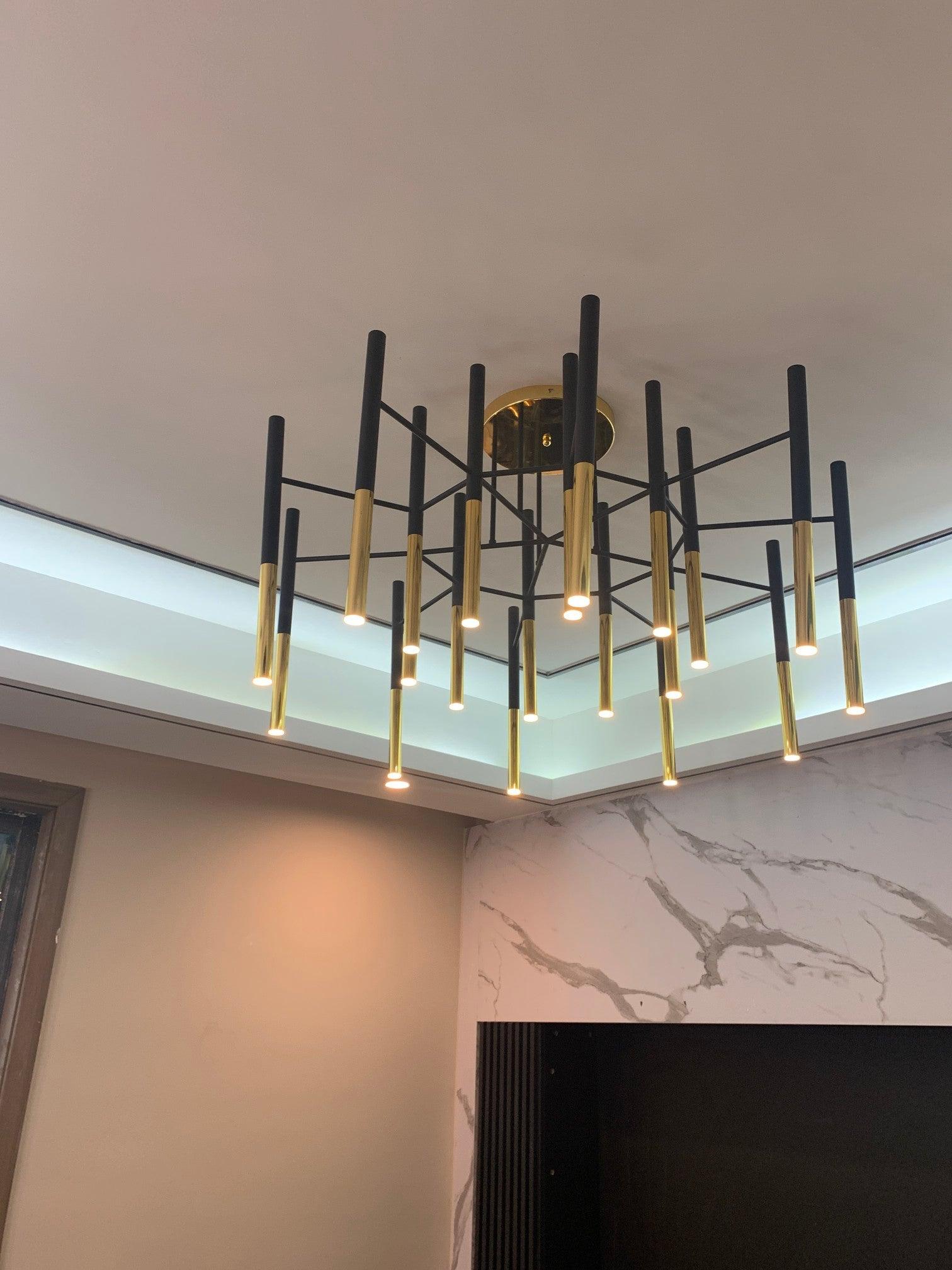 Modern Metal Tubular Chandelier with Multi Directional LED Lighting in Black and Gold