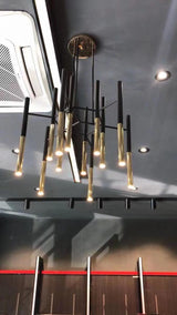 Modern Metal Tubular Chandelier with Multi Directional LED Lighting in Black and Gold