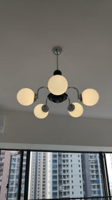 modern-mid-century-glass-globe-chandelier-with-metal-rod-frame-and-white-opal-shades